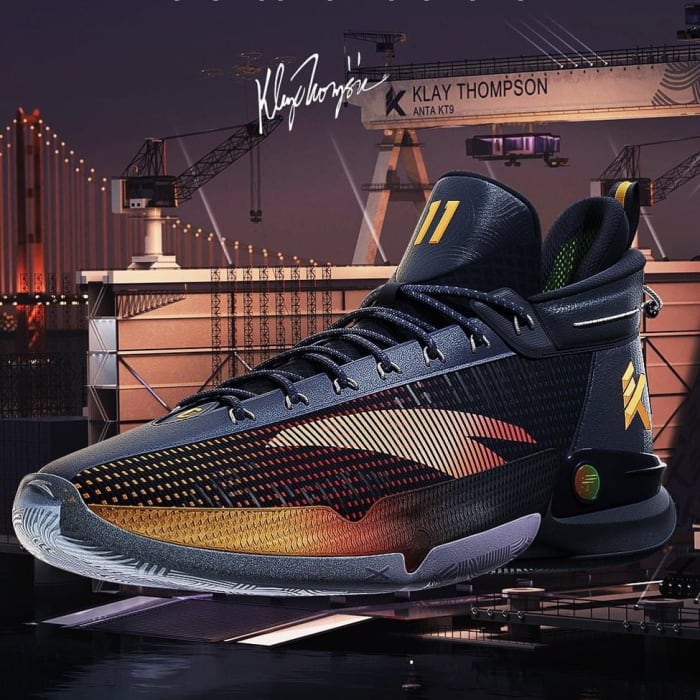 Side view of Klay Thompson's black and gold ANTA basketball shoe.